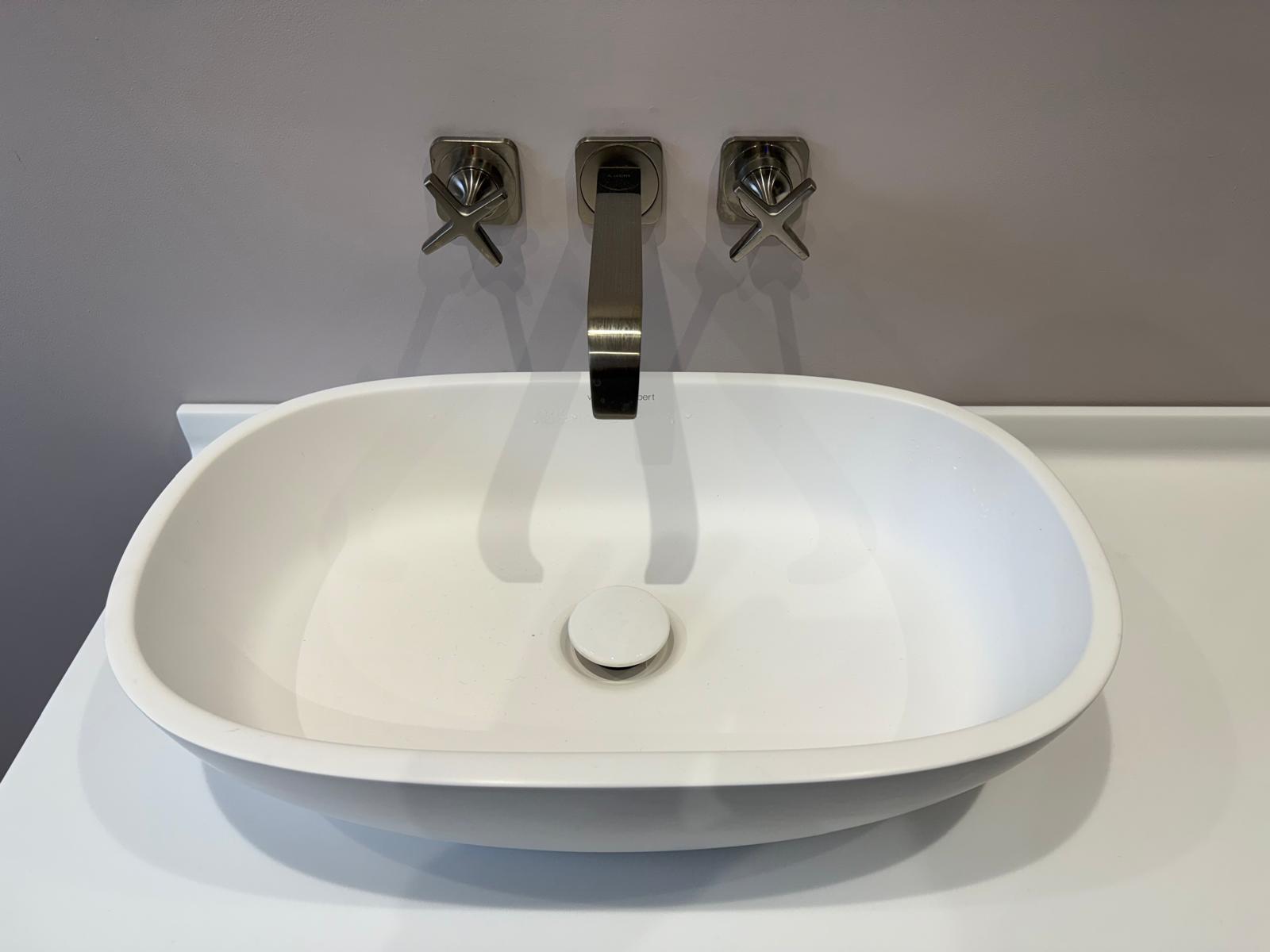 Countertop basin with wall-mounted brass taps from a recent Astbury bathroom job